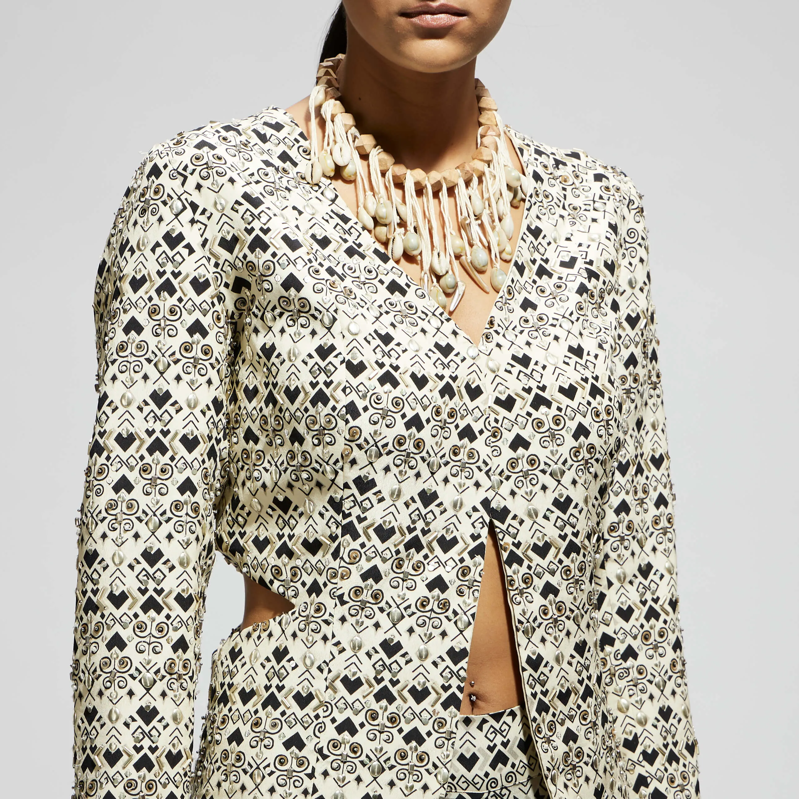White embellished side cut out jacket and pants